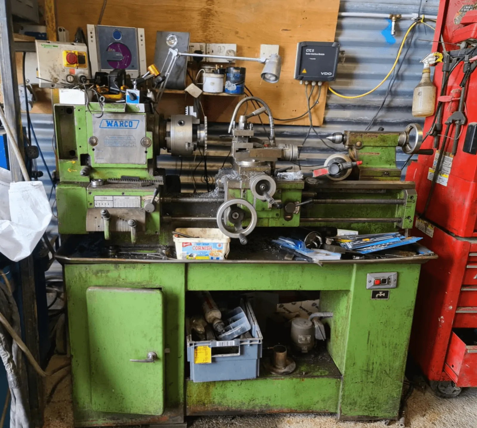 Green metalworking lathe and tools in the workshop