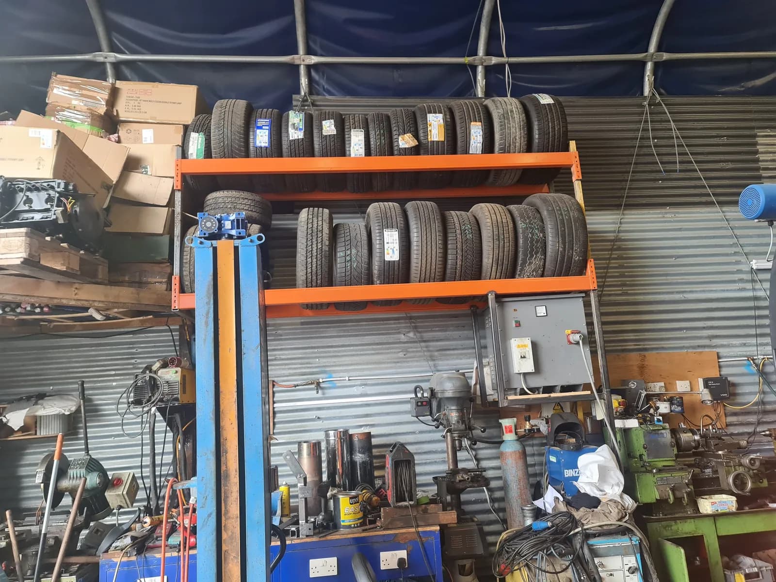 Tools, vehicle lift and equipment arranged inside the workshop